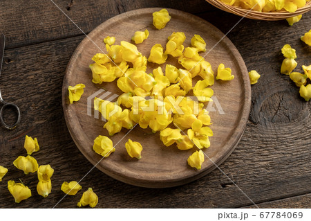 Fresh mullein flowers on a table, top view 67784069