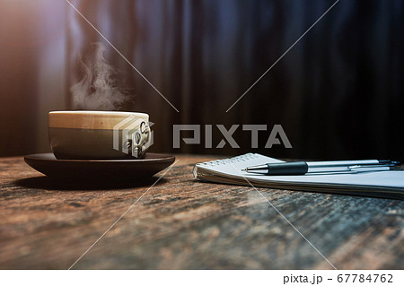 Workplace with a coffee Cup, on a wooden table 67784762