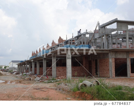 SEREMBAN, MALAYSIA -APRIL 07, 2020: New double story luxury terrace house under construction in Malaysia.  Designed by an architect with a modern and contemporary style.  67784837