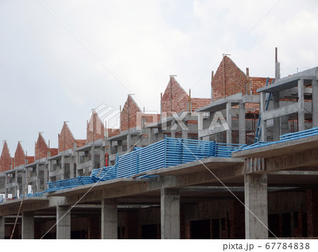 SEREMBAN, MALAYSIA -APRIL 07, 2020: New double story luxury terrace house under construction in Malaysia.  Designed by an architect with a modern and contemporary style.  67784838