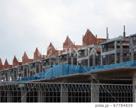 SEREMBAN, MALAYSIA -APRIL 07, 2020: New double story luxury terrace house under construction in Malaysia.  Designed by an architect with a modern and contemporary style.  67784839