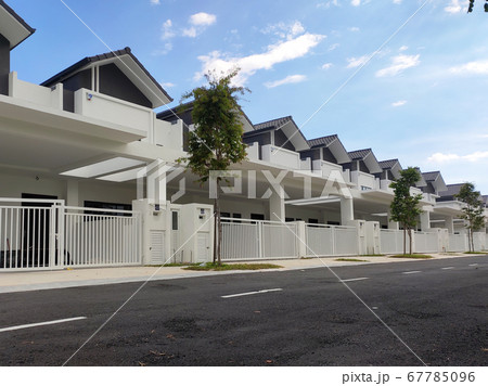 SEREMBAN, MALAYSIA -APRIL 08, 2020: New double story luxury terrace house in Malaysia. Designed by an architect with a modern and contemporary style. Ready to receive occupants. SEREMBAN, MALAYSIA -APRIL 08, 2020: New double story luxury terrace house in Malaysia. Designed by an architect with a modern and contemporary style. Ready to receive occupants. 67785096