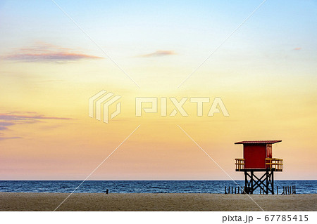 Beach rescue cabin at tropical sunset 67785415