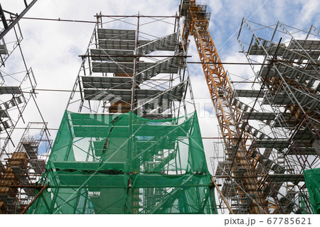 SEREMBAN, MALAYSIA -MAY 24, 2020: Temporary access and metal staircase made from staging, scaffolding and metal platform under construction at the construction site.  67785621