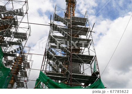 SEREMBAN, MALAYSIA -MAY 24, 2020: Temporary access and metal staircase made from staging, scaffolding and metal platform under construction at the construction site.  67785622