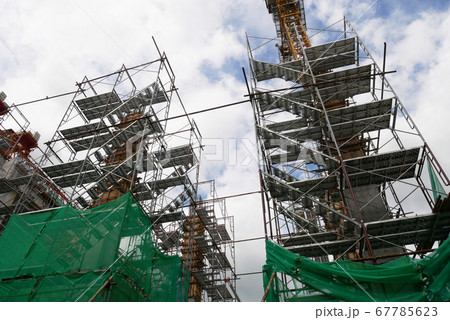 SEREMBAN, MALAYSIA -MAY 24, 2020: Temporary access and metal staircase made from staging, scaffolding and metal platform under construction at the construction site.  67785623