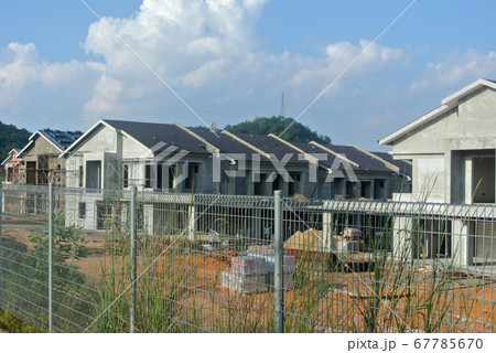 SEREMBAN, MALAYSIA -APRIL 07, 2020: New double story luxury terrace house under construction in Malaysia.  Designed by an architect with a modern and contemporary style.  67785670