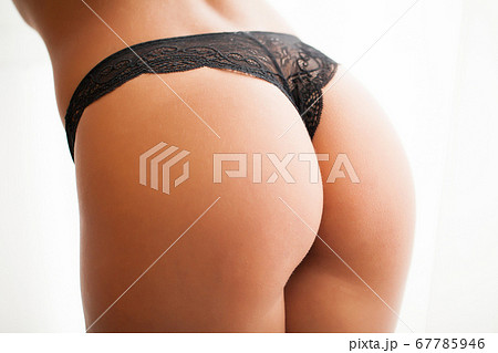 Sexy girl undresses in a black panties in a sunny room Sexy girl undresses in a black panties in a sunny room 67785946