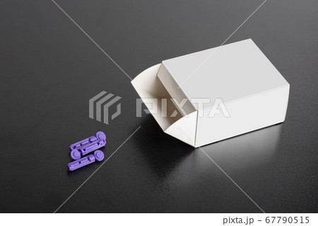 Needle tips package on dark background mock-up Needle tips package on dark background mock-up 67790515