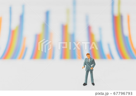 Miniature people businessman standing on  chart graph 67796793