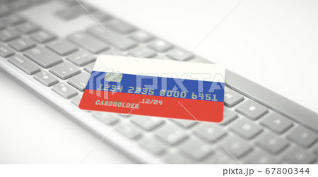 Bank card depicting flag of Russia on computer keyboard. Fictional numbers 67800344
