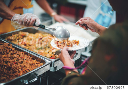 Volunteers Share Food to the Poor to Relieve Volunteers Share Food to the Poor to Relieve 67800993