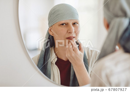 Mature Woman Putting On Make up 67807927