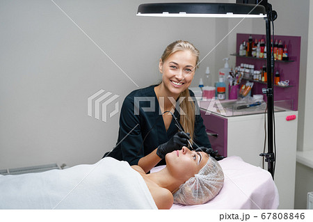 Cosmetology cabinet client lies on couch. Cosmetology cabinet client lies on couch. 67808846