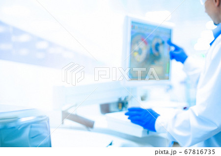 Laboratory assistant in rubber gloves working with Laboratory assistant in rubber gloves working with 67816735
