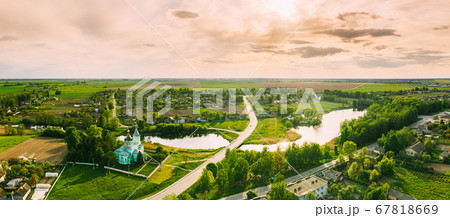 Krupets, Dobrush District, Gomel Region, Belarus. Aerial View Of Old Wooden Orthodox Church Of The Holy Trinity At Sunny Autumn Day Krupets, Dobrush District, Gomel Region, Belarus. Aerial View Of Old Wooden Orthodox Church Of The Holy Trinity At Sunny Autumn Day 67818669