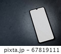 Black mobile smartphone mockup lies on the surface 67819111