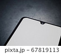 Black mobile smartphone mockup lies on the surface 67819113