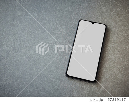 Black mobile smartphone mockup lies on the surface 67819117