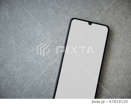 Black mobile smartphone mockup lies on the surface 67819120