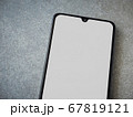 Black mobile smartphone mockup lies on the surface 67819121