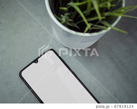 Modern minimalist workspace with black mobile 67819124
