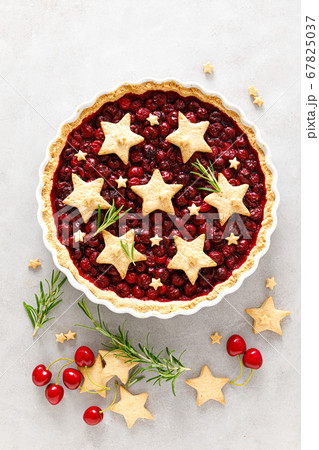 Homemade cherry pie, tart with star shaped cookies 67825037