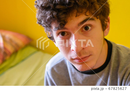 Portrait of a brown curly haired caucasian boy 67825627