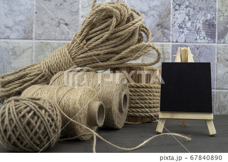 Assorted balls of hemp twine with rope and slate Assorted balls of hemp twine with rope and slate 67840890