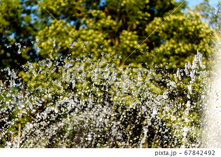 Selective focus on spray of urban fountain and Selective focus on spray of urban fountain and 67842492