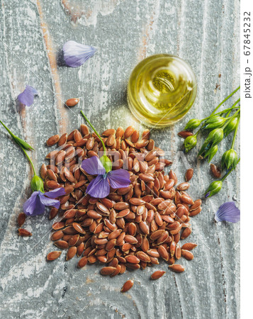 Flax seeds and flaxseed oil with copy space 67845232