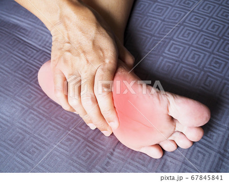 woman with foot pain and nerve inflammation 67845841