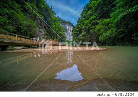 Tourists on a path along river in Wulong National Tourists on a path along river in Wulong National 67852104