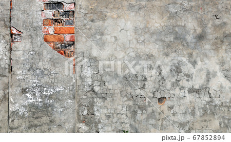 Texture of old brick wall and cracked stucco of 67852894