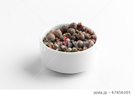 Isolated mixture of different peppers in a bowl 67856305