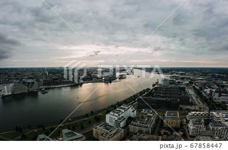 Amsterdam cityscape of canal river at central station 67858447