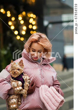 Girl walks with a dog 67858559