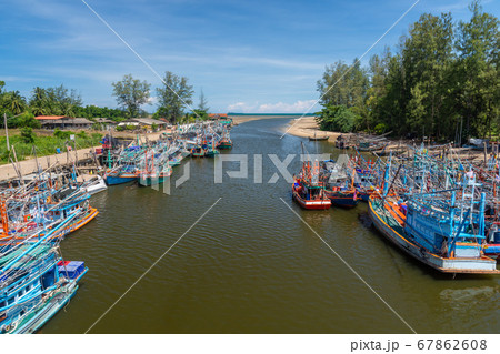 Fisherman boat in fishing port, Thailand. The mouth of the river into the Thai sea  67862608