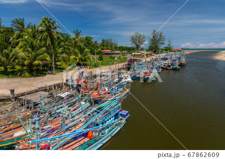Fisherman boat in fishing port, Thailand. The mouth of the river into the Thai sea Fisherman boat in fishing port, Thailand. The mouth of the river into the Thai sea 67862609