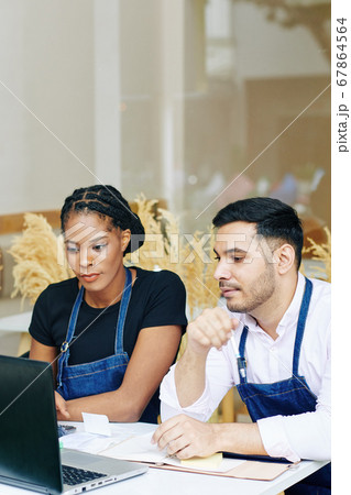 Bakery owners discussing plan of development Bakery owners discussing plan of development 67864564