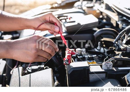 Mechanic repairman checking engine automotive in 67866486