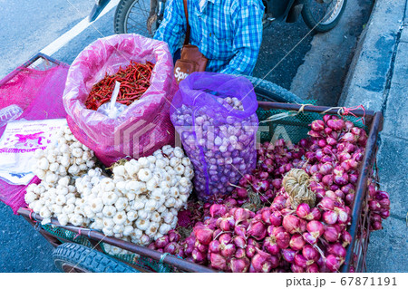 Asian street vendor sells seasonings, onions, Asian street vendor sells seasonings, onions, 67871191