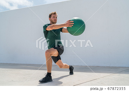Working out man training legs and core ab workout Working out man training legs and core ab workout 67872355
