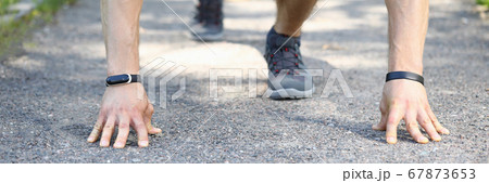 Person holding hands on asphalt Person holding hands on asphalt 67873653