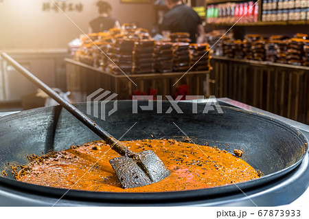 Closeup shot of a large shovel mixing seafood stew 67873933