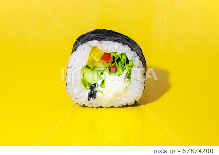 sushi on a yellow background close up 67874200