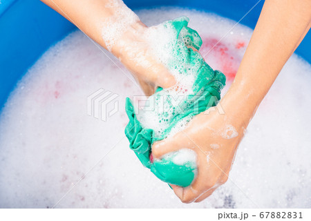 Female squeeze wring out wet fabric cloth Female squeeze wring out wet fabric cloth 67882831