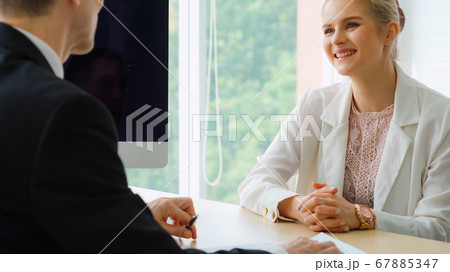 Job seeker in job interview meeting with manager Job seeker in job interview meeting with manager 67885347