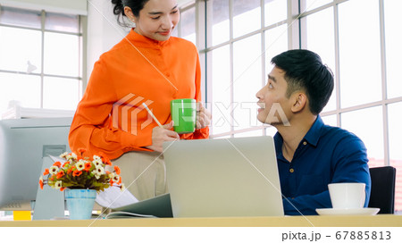 Two business people talk project strategy at office 67885813
