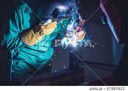 Metal welding steel works using electric arc welding machine 67885822